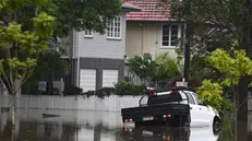 epa11952933 Flooded houses are seen in Oxley, in Brisbane, Australia, 10 March 2025. A cyclone has been downgraded to a tropical low but its impact is still being felt with a region reeling from major flooding with more wild weather forecast. EPA/JONO SEARLE AUSTRALIA AND NEW ZEALAND OUT