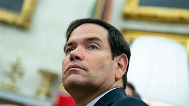 epa11922262 US Secretary of State Marco Rubio looks on while President Donald Trump meets with President of France Emmanuel Macron in the Oval Office at the White House in Washington, DC, USA, 24 February 2025. EPA/BONNIE CASH / POOL