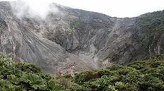 epa09428354 General view of the craters of the Irazu Volcano park, during the commemoration of National Parks Day, in the province of Cartago, Costa Rica, 24 August 2021. According to official data, Costa Rica has 149 protected areas that cover 13,031 square kilometers in the land area, which is equivalent to 25.5 percent of the country's surface. With a territory of 51,100 square kilometers and some 500,000 species, the Central American country has 6 percent of the world's biodiversity. EPA/Jeffrey Arguedas