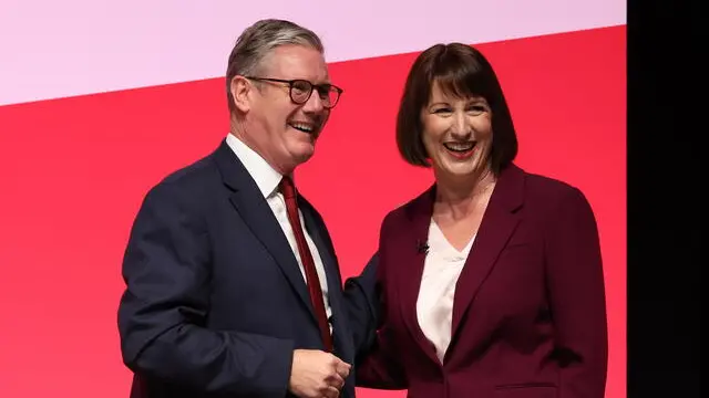 epa11620616 British Prime Minister, Sir Keir Starmer (L), congratulates British Chancellor of the Exchequer, Rachel Reeves (R), following her speech at the Labour Party Conference in Liverpool, Britain, 23 September 2024. The conference runs from 22 to 25 September at the Arena Convention Centre in Liverpool. EPA/ADAM VAUGHAN