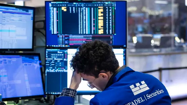 epa11956748 A trader on the floor of the New York Stock Exchange in New York, New York, USA, 11 March 2025. Major stock indices have reacted in recent days to statements from US President Donald Trump about increased tariffs on goods being imported from Canada and Mexico. EPA/JUSTIN LANE