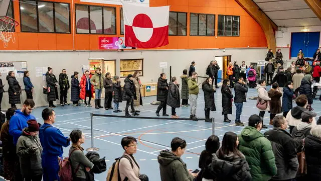 epaselect epa11956534 People line up to vote during the parliamentary election at the Godthaabshallen sports hall, in Nuuk, Greenland, 11 March 2025. Greenland residents will vote on 11 March to elect 31 members to the Inatsisartut, the Greenlandic parliament, with six parties contesting. EPA/MADS CLAUS RASMUSSEN DENMARK OUT