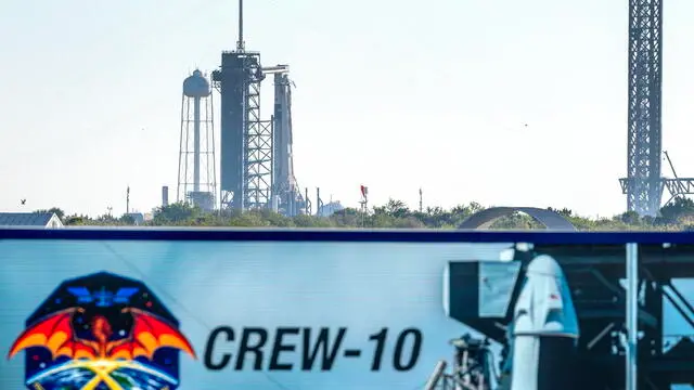 epaselect epa11958828 The NASA SpaceX Dragon Endeavour spacecraft on a Falcon 9 rocket, that will carry the NASA's Crew-10, is seen docked, behind the NASAâ€™s Press Site's clock, at the Kennedy Space Center Launch Complex 39A as part of its launch preparations at NASA's Kennedy Space Center in Titusville, Florida, USA, 12 March 2025. The Crew-10 is the 10th crew rotation mission of SpaceX's human space transportation system and its 11th flight with astronauts, including the Demo-2 test flight, to the space station through NASA's Commercial Crew Program. The Crew-10 members are NASA astronaut Nichole Ayers, NASA astronaut Anne McClain, Roscosmos cosmonaut Kirill Peskov and JAXA (Japan Aerospace Exploration Agency) astronaut Takuya Onishi. EPA/CRISTOBAL HERRERA-ULASHKEVICH