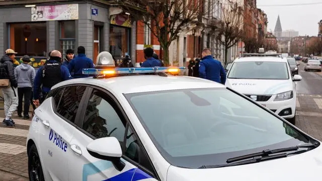 epa11876660 Belgian police officers secure the area outside the Clemenceau Metro station after a shooting in Brussels, Belgium, 05 February 2025. Police in Brussels are hunting for the suspects of a shooting that was reported outside a Brussels metro station in the morning. Several metro and bus lines were interrupted causing travel disruptions. EPA/OLIVIER MATTHYS