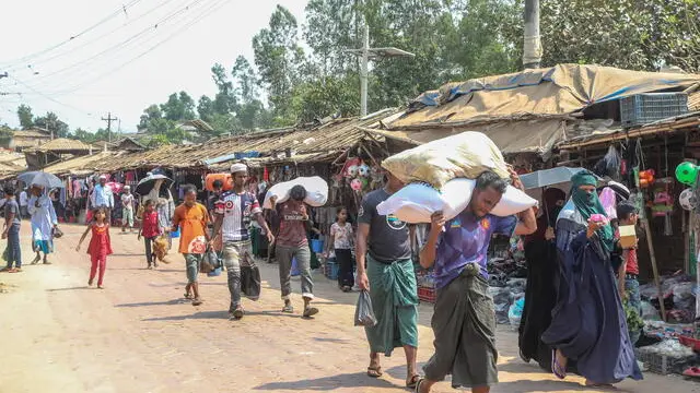 epa11961113 Rohingya refugees walk in a street in a makeshift camp in Kutupalong, Ukhiya Cox's Bazar, Bangladesh, 13 March 2025. United Nations Secretary-General Antonio Guterres is expected to visit the Rohingya refugee camps in Cox's Bazar on 14 March 2025. Guterres is on an official visit to Bangladesh from March 13 to 16 at the invitation of Bangladesh's interim government Chief Adviser Yunus. EPA/MONIRUL ALAM