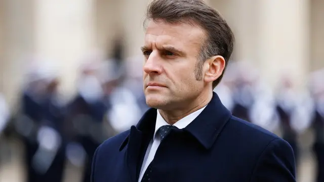 epa11958333 France's President Emmanuel Macron stands with Uzbekistan's President Shavkat Mirziyoyev (not pictured) during an official welcome ceremony at the Invalides in Paris, France, 12 March 2025. EPA/LUDOVIC MARIN / POOL MAXPPP OUT