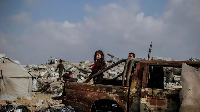 epa11952479 Palestinian children play around their families tents between destroyed buildings in Al Zaitun neighbourhood, east of Gaza City, 09 March 2025. More than 48,000 Palestinians have been killed in the Gaza Strip, according to the Palestinian Ministry of Health, since Israel launched a military campaign in the strip in response to a cross-border attack led by the Palestinian militant group Hamas on 07 October 2023, in which about 1,200 Israelis were killed and more than 250 taken hostage. EPA/MOHAMMED SABER