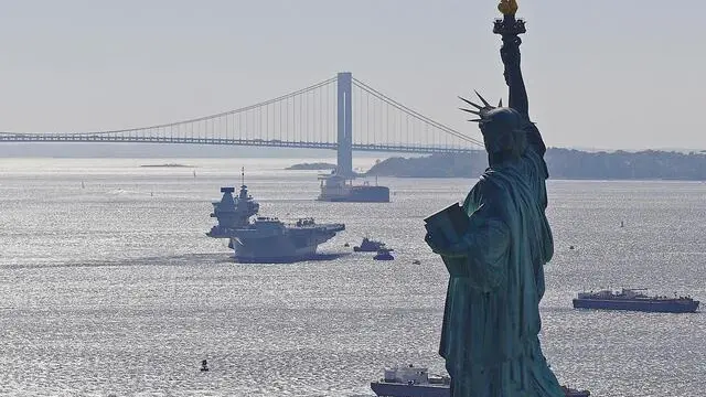 epa07105313 A handout photo made available by the British Ministry of Defence shows British Royal Navy's aircraft carrier HMS Queen Elizabeth as she arrives at New York Harbour with the Statue of Liberty in the foreground, in New York, USA, 19 October 2018. The largest ship in the history of Great Britainâs Royal Navy, which has been home to more than 1,500 military and civilian personnel for the past two months, anchored in New York Harbour under the gaze of the Statue of the Liberty. EPA/LPhot Kyle Heller HANDOUT MANDATORY CREDIT: CROWN COPYRIGHT HANDOUT EDITORIAL USE ONLY/NO SALES
