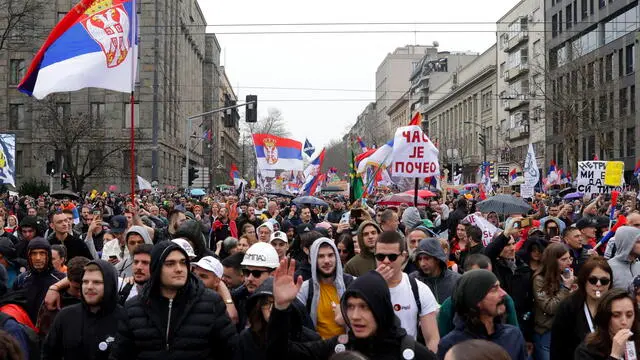 epa11966398 Protesters wave Serbian flags during the student-led rally in Belgrade, Serbia, 15 March 2025. University students staged a protest, demanding accountability after fifteen people lost their lives in the collapse of the Novi Sad Railway Station canopy in November 2024. The station building, which had been renovated and reopened in July 2024, was undergoing further renovations shortly before the collapse. EPA/ANDREJ CUKIC