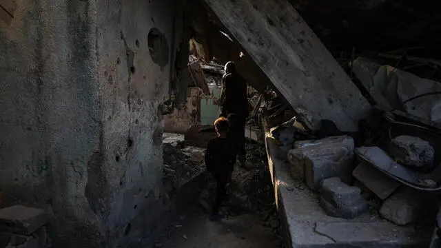 epa11970599 Palestinians go about their daily business among the rubble of destroyed buildings during the holy month of Ramadan in Jabalia refugee camp, northern Gaza Strip, 17 March, 2025. EPA/HAITHAM IMAD