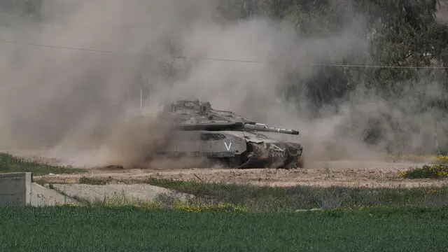 epa11971168 An Israeli tank patrols along the border with the Gaza Strip, as seen from an undisclosed location in Israel, 18 March 2025. The Israeli forces on 18 March confirmed they were carrying out 'extensive strikes' on targets in the Gaza Strip, following an Israeli prime minister's statement which ended the ceasefire in place since 19 January. According to provisional figures released by the Palestinian Health Minister, more than 400 people were killed in a series of overnight strikes in the Gaza Strip. EPA/ATEF SAFADI