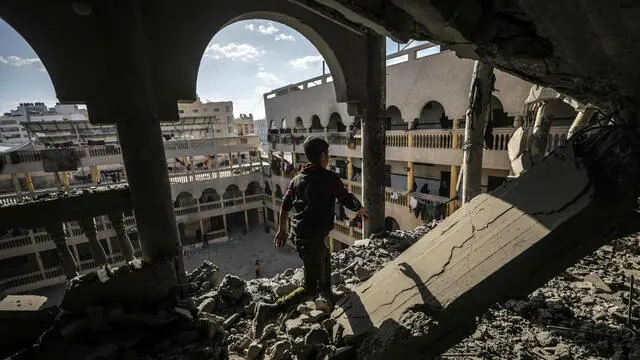 epaselect epa11970913 A Palestinian boy inspects a destroyed area of Al Tabien school following Israeli airstrikes in Gaza City, 18 March 2025. The Israeli forces on 18 March confirmed they were carrying out 'extensive strikes' on targets in the Gaza Strip, following an Israeli prime minister's statement which ended the ceasefire in place since 19 January. According to provisional figures released by the Palestinian Health Minister, more than 250 people were killed in a series of overnight strikes in the Gaza Strip, with more bodies still waiting to be recovered from under the rubble. EPA/MOHAMMED SABER