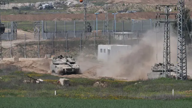 epa11971167 An Israeli tank patrols along the border with the Gaza Strip, as seen from an undisclosed location in Israel, 18 March 2025. The Israeli forces on 18 March confirmed they were carrying out 'extensive strikes' on targets in the Gaza Strip, following an Israeli prime minister's statement which ended the ceasefire in place since 19 January. According to provisional figures released by the Palestinian Health Minister, more than 400 people were killed in a series of overnight strikes in the Gaza Strip. EPA/ATEF SAFADI