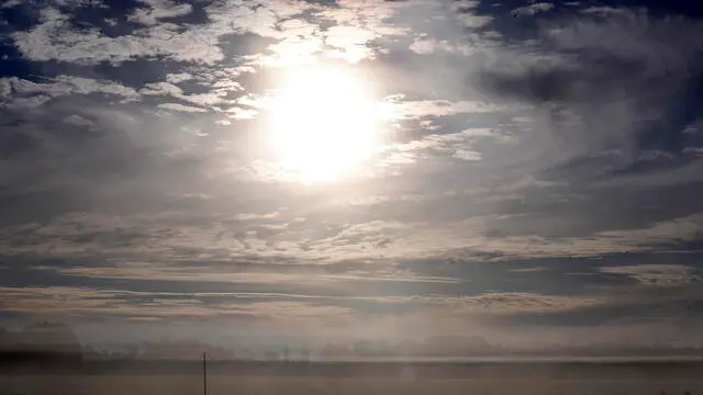 epa11646937 The sun shines during a foggy morning over fields near Sabile in Latvia, 07 October 2024. In the middle of this week, the weather in Latvia will become warmer, and the temperature will be close to 20 degrees in places, according to forecasts. There will be no showers early in the week, but fog will form at night and in the mornings, with rain expected at times starting midweek.Ê EPA/TOMS KALNINS
