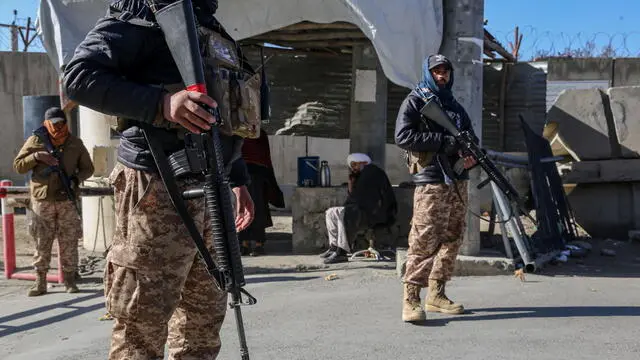 epa11771848 Taliban security stand guard at a checkpoint in Kabul, Afghanistan, 12 December 2024. Khalil Rahman Haqqani, the Taliban government's acting minister of refugees and a senior member of the Haqqani network, was killed in a bomb blast at the ministry building in Kabul on 11 December, resulting in multiple casualties among government employees, police said. EPA/SAMIULLAH POPAL