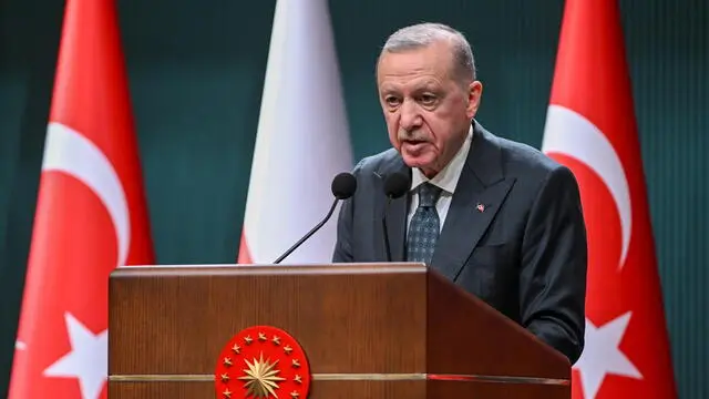 epa11959112 Turkish President Recep Tayyip Erdogan speaks during a joint press conference after a meeting with Polish Prime Minister Donald Tusk (unseen) in Ankara, Turkey, 12 March 2025. Poland's Prime Minister Tusk is on a two-day visit to Turkey. EPA/NECATI SAVAS