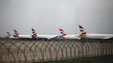 epaselect epa11978516 British Airways planes parked at Heathrow Airport in London, Britain, 21 March 2025. Heathrow Airport announced on 21 March that it would be closed all day following a power outage 'due to a fire at an electrical substation supplying the airport'. EPA/TOLGA AKMEN