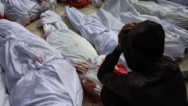 epa11975541 A Palestinian reacts before the bodies of people killed in overnight Israeli airstrikes in the northern Gaza Strip, outside the Indonesian Hospital in Beit Lahia, 20 March 2025. On 18 March Israeli forces resumed airstrikes on Gaza ending a ceasefire held in place since 19 January and killing over 400 people on the first day, the Health Ministry confirmed. EPA/HAITHAM IMAD