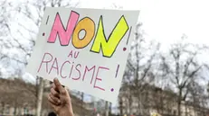 epa11981808 A man with a placard 'No for racism', take aprt in a nationwide demonstration against racism and fascism marking International Day Against Racism and Discrimination in Paris, France, 22 March 2025. EPA/MOHAMMED BADRA