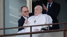 Pope Francis delivers his blessing, after the Angelus prayer, from a window of the Agostino Gemelli Hospital in Rome. Pope Francis will be discharged today with prescription for two months of rest after spending more than five weeks in the hospital or a bilateral pneumonia, Italy, 23 March 2025. ANSA/GIUSEPPE LAMI