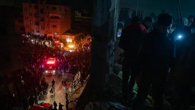 epa11779843 Palestinians inspect the site after an Israeli airstrike hit a UNRWA-run school sheltering displaced people, in Khan Yunis, southern Gaza Strip, 15 December 2024. According to medics at Nasser Hospital, at least 15 Palestinians were killed in the Israeli airstrike. More than 45,000 Palestinians and over 1,400 Israelis have been killed, according to the Palestinian Health Ministry and the Israeli Army, since Hamas militants launched an attack against Israel from the Gaza Strip on 07 October 2023, and the Israeli operations in Gaza and the West Bank which followed it. EPA/HAITHAM IMAD