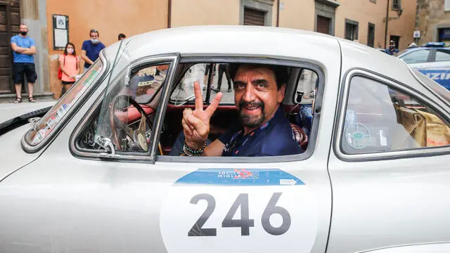 Valerio Staffelli on board of a vintage and historic cars of the ‘Mille Miglia' vintage car rally's, in Orvieto, Italy, 18 June 2021. The classic Mille Miglia (1,000 Miles) is a race from Brescia to Rome and back. ANSA/FABIO FRUSTACI