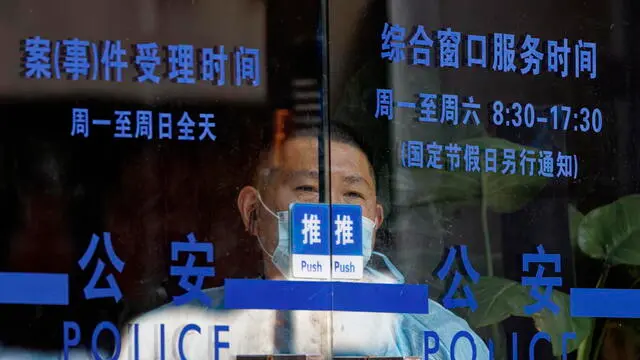 epa10054375 A man stands in police station, in Shanghai, China, 06 July 2022. An anonymous person on an online hacking forum has reportedly posted data for sale for 10 Bitcoins (about 150,000 euros) that includes terabytes of information on one billion Chinese citizens, allegedly hacked from the Shanghai police database. There was no official comment from the Chinese authorities on the alleged data leak. EPA/ALEX PLAVEVSKI POLICE HACKING CYBER CRIME TECHNOLOGY