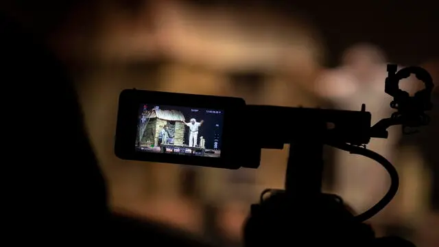 epa09100565 A screen of a camera shows stage actor and director Deniz Ozmen and stage actor Berk Yaygin of La trahison d'Einstein during a live broadcast performance at the Moda Theater in Istanbul, Turkey, 26 February 2021 (issued 27 March 2021). World Theater Day is international observed on 27 March. EPA/ERDEM SAHIN ATTENTION: This Image is part of a PHOTO SET