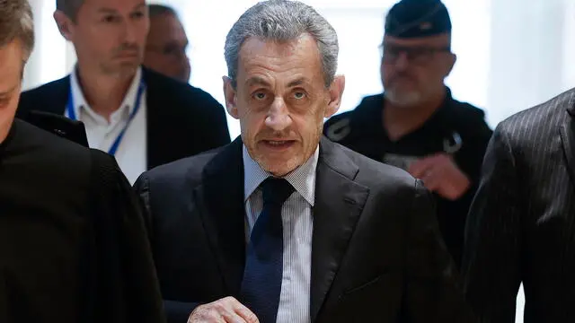 epa11992041 French former President Nicolas Sarkozy (C) arrives at the courthouse in Paris, France, 27 March 2025. Sarkozy and twelve other people, including three former ministers, stand trial for criminal conspiracy to receive funds for the 2007 presidential campaign from the regime of late Libyan leader Muammar Gaddafi. Nicolas Sarkozy has already been convicted twice, in two separate cases, since he left office in 2012. The trial will last until 10 April. EPA/YOAN VALAT