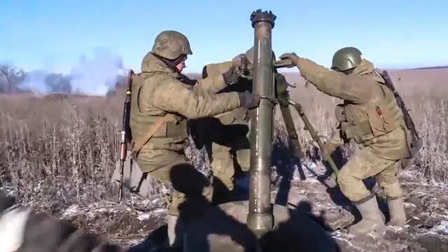 epa10403449 A still image taken from a handout video provided by the Russian Defence Ministry Press-Service on 13 January 2023 shows artillery units of Russia's Marine Corps of the Pacific Fleet providing fire support in the Ugledar direction using 20-mm mortars 2S12 'Sani' at an undisclosed location in Ukraine. The Russian Defence Ministry said that 'in the evening of 12 January, the city of Soledar, that is of great importance for continuing successful offensive operations in Donetsk direction, was liberated' as what Moscow calls a 'special military operation' continues in Ukraine. Russian troops entered Ukrainian territory on 24 February 2022, starting a conflict that has provoked destruction and a humanitarian crisis. EPA/RUSSIAN DEFENCE MINISTRY PRESS SERVICE HANDOUT -- MANDATORY CREDIT -- BEST QUALITY AVAILABLE -- HANDOUT EDITORIAL USE ONLY/NO SALES