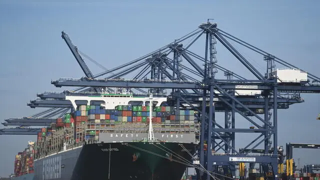 epa08887448 Containers are unloaded from ships at the Port of Felixstowe, Britain, 16 December 2020. Felixstowe is the largest and busiest container port on the UK. Talks are still ongoing between the European Union (EU) and Britain over the final Brexit trade deal. New rules in travel, transport and trade will come into place on 01 January 2021 as the UK's transition period for leaving the EU will end. EPA/NEIL HALL