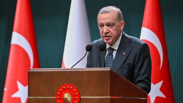 epa11959112 Turkish President Recep Tayyip Erdogan speaks during a joint press conference after a meeting with Polish Prime Minister Donald Tusk (unseen) in Ankara, Turkey, 12 March 2025. Poland's Prime Minister Tusk is on a two-day visit to Turkey. EPA/NECATI SAVAS