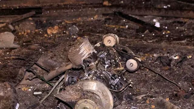 epa12019713 Remnants of a Russian shock drone at the site of a drone attack in Kharkiv, Ukraine, late 08 April 2025 (issued 09 April 2025), amid the ongoing Russian invasion. According to the State Emergency Service, at least two people were injured in the attack. EPA/SERGEY KOZLOV