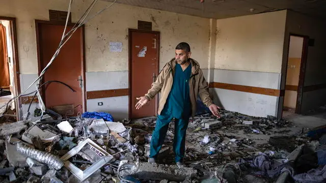 epa11984979 Palestinian Dr. Marwan al-Hams, director of the Field Hospitals Department in Gaza, reacts as he inspects the damage inside the surgical building of the Nasser Hospital, a day after it was targeted by Israeli strikes, in Khan Yunis, southern Gaza Strip, 24 March 2025. Israeli forces resumed airstrikes on Gaza on 18 March, ending a ceasefire that had been in place since 19 January. More than 50,000 Palestinians have been killed in the Gaza Strip, according to the Palestinian Ministry of Health, since Israel launched a military campaign in the strip in response to a cross-border attack led by the Palestinian militant group Hamas on 07 October 2023, in which about 1,200 Israelis were killed and more than 250 taken hostage. EPA/HAITHAM IMAD
