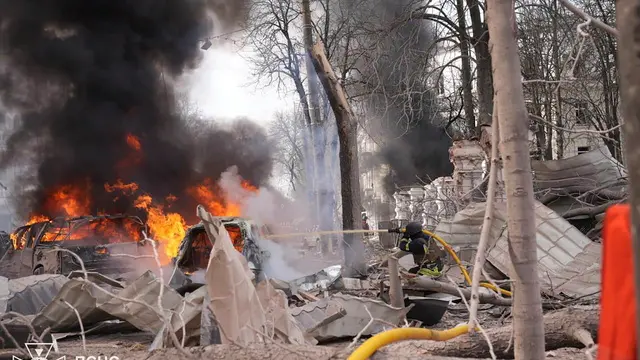 epa12029024 A handout photo made available by the State Emergency Service of Ukraine (SES) shows Ukrainian rescuers working at the site of a rocket strike in downtown Sumy, Ukraine, 13 April 2025, amid the ongoing Russian invasion. At least 31 people were killed, including two children, and 84 people were injured, including 10 children, after a Russian rocket hit downtown Sumy in the morning, according to a report by the State Emergency Service. EPA/STATE EMERGENCY SERVICE OF UKRAINE HANDOUT HANDOUT EDITORIAL USE ONLY/NO SALES