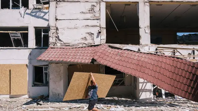 epa11554412 Materials to begin repairs are brought to the school building which was destroyed by two Russian glide bombs overnight 17 August 2024 in the village of Yunakivka, 9 kilometers from the border with Russia in the Sumy region, Ukraine, 18 August 2024 amid the Russian invasion. There is no electricity or water supply in the village due to the permanent shelling by Russian forces. Ukrainian troops have advanced 35 kilometers with battles, taken control of 1,150 square kilometers of the territory of the Russian Federation and 82 settlements since the beginning of the operation in the Kursk region on 06 August 2024 according to the report of the Commander-in-Chief of the Ukrainian Armed Forces Oleksandr Syrskyi at the meeting of the Staff on 15 August 2024. Russian troops entered Ukrainian territory on 24 February 2022, starting a conflict that has provoked destruction and a humanitarian crisis. EPA/GEORGE IVANCHENKO