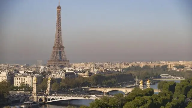 epa06341070 (FILE) - The Eiffel Tower dominates the skyline, in Paris, France, 09 April 2017 (reissued 20 November 2017). According to reports, Paris has won a bid to become the host city of the European Banking Authority (EBA), which will be relocated from London as a consequence to the Brexit. EPA/IAN LANGSDON