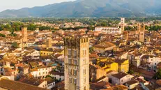 View of the medieval town of Lucca, art city named " town of 100 church", enclosed into the circle of the sixteenth-century walls which numerous ancient towers, the last day of the lockdown phase 2 emergency period aimed to conserve low spread level of Covid-19 coronavirus and open more free circulation of people. Although the scenery of the Italian squares and monuments remain fascinating, Lucca, Italy, 17 May 2020. (ANSA foto Fabio Muzzi)