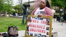epa12037138 Evonna McIntosh holds a poster outside of the Menendez brothers resentencing hearing in Los Angeles, California, USA, 17 April 2025. Brothers Lyle and Erik Menendez were sentenced in 1996 for first degree murder for killing their parents, Jose and Kitty Menendez, but new evidence in the case has led prosecutors to reexamine the brothers' sentencing. EPA/CAROLINE BREHMAN