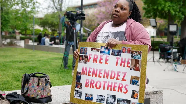 epa12037138 Evonna McIntosh holds a poster outside of the Menendez brothers resentencing hearing in Los Angeles, California, USA, 17 April 2025. Brothers Lyle and Erik Menendez were sentenced in 1996 for first degree murder for killing their parents, Jose and Kitty Menendez, but new evidence in the case has led prosecutors to reexamine the brothers' sentencing. EPA/CAROLINE BREHMAN