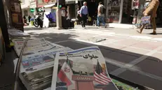 epa12040370 A copy of Iranian weekly newspaper Omid Javan reporting about Iran and US nuclear talks, in a kiosk in Tehran, Iran, 19 April 2025. Iran and the USA were expected to hold a second round of nuclear talks on 19 April 2025, in Rome, Italy. EPA/ABEDIN TAHERKENAREH