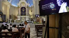 epa12044085 Images of Pope Francis are displayed inside the Immaculate Conception Cathedral of Cubao as Catholic parishioners gather for a holy Mass in Quezon City, Metro Manila, Philippines, 21 April 2025. Pope Francis died on 21 April 2025 at the age of 88, according to the Holy See. Born Jorge Mario Bergoglio in Buenos Aires, Argentina, on 17 December 1936, he was appointed leader of the Catholic Church on 13 March 2013, succeeding Pontiff Emeritus Benedict XVI. EPA/ROLEX DELA PENA
