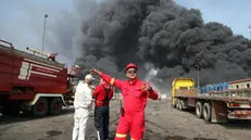 epa12056410 Firefighters wok at the site of an explosion at the Rajaie port in the city of Bandar Abbas, southern Iran, 26 April 2025. Iranian state media reported on 26 April several injuries in an explosion at the port, but authorities have not yet announced the cause. EPA/Mohammad Rasoul Moradi