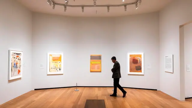 epa10976757 Visitors to the East Building of the National Gallery of Art preview the exhibition 'Mark Rothko: Paintings on Paper' in Washington, DC, USA, 15 November 2023. The exhibition includes more than 100 of the famed artist's paintings, including watercolors and abstracts. They will be on display from 19 November 2023 to 31 March 2024. EPA/JIM LO SCALZO