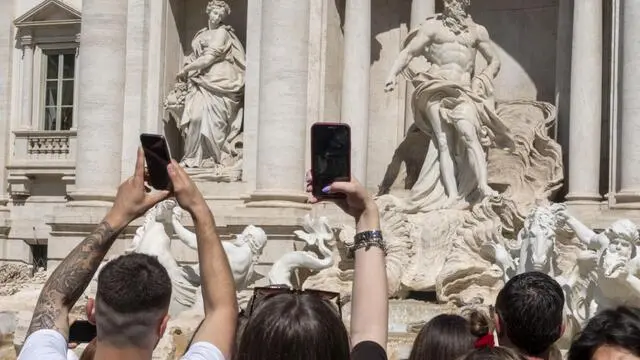 Tourists visit the Trevi Fountain for the long public holiday between April 25 and First May (Labour Day) in Rome, Italy, April 25, 2023. There will be over 17 million Italians who will allow themselves a break between 25 April and 1 May. In particular, 9 million Italians will travel for the Liberation Day while 8 million and 99 thousand will travel for the workers' day. ANSA/LUCIANO DEL CASTILLO