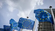 epa12046759 EU flags fly at half-mast in front of the European Commission headquarters, one day after the death of Pope Francis, in Brussels, Belgium, 22 April 2025. Pope Francis died on 21 April 2025 at the age of 88, according to the Holy See. EPA/OLIVIER MATTHYS
