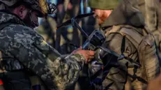 epa10292403 Ukrainian soldiers launch a drone at the frontline at the northern Kherson region, Ukraine, 07 November 2022. Russian troops on 24 February entered Ukrainian territory, starting a conflict that has provoked destruction and a humanitarian crisis. EPA/HANNIBAL HANSCHKE