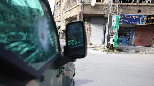 epa12062936 Syrian security forces secure the area following armed clashes in Jaramana town, near Damascus, Syria, 29 April 2025. According to the Interior Ministry, at least 13 people were killed during armed clashes in Jaramana town, largely populated by the country’s Druze minority. Following 'intermittent clashes between groups of gunmen,' security officers 'went to break up the clashes and protect the residents,' the Interior Ministry stated. EPA/MOHAMMED AL RIFAI