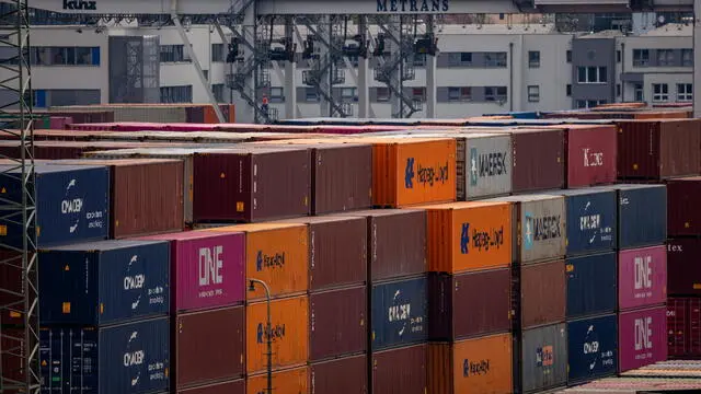 epa12031430 Containers are stacked at a transshipment terminal in Prague, Czech Republic, 14 April 2025. US President Trump initiated a trade war with most of America's trading partners, as several countries were granted a temporary tariffs exemption. EPA/MARTIN DIVISEK