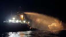 epa12069186 A handout photo made available by the Malta Government Department of Information (DOI) shows a tug vessel contacted by the Malta Vessel Traffic Services (VTS) extinguishing a fire on the ship Conscience in international waters, 02 May 2025. Maltese authorities said in a statement that all 16 people aboard, 12 crew and four passengers, were safe after receiving a distress call about a fire on the bow of the vessel outside Maltese territorial waters. The ship remained in international waters and was being monitored by authorities. Activists from the Freedom Flotilla Coalition claimed their ship Conscience, carrying aid intended for Gaza, was struck by drones. EPA/GOVERNMENT OF MALTA HANDOUT -- MANDATORY CREDIT: GOVERNMENT OF MALTA -- BEST QUALITY AVAILABLE -- HANDOUT EDITORIAL USE ONLY/NO SALES